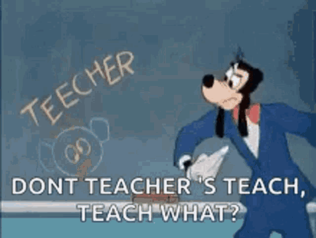 goofy is standing in front of a blackboard and pointing at it .