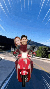 a man and woman are riding a red scooter
