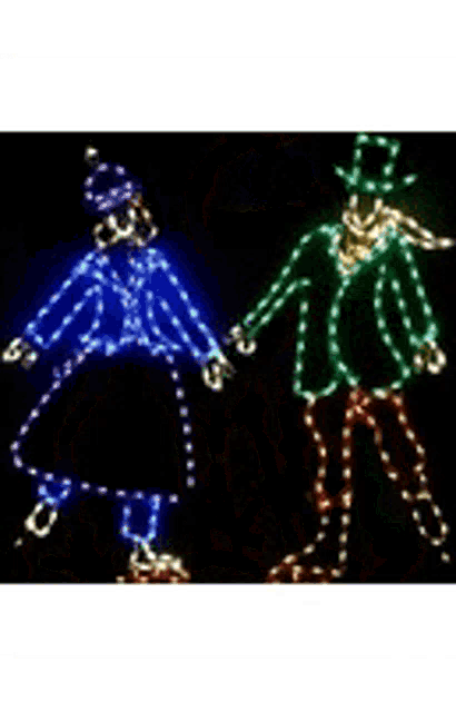 a christmas light display of a cake with a candle