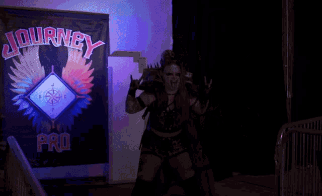 a woman in a costume stands in front of a sign that says journey pro