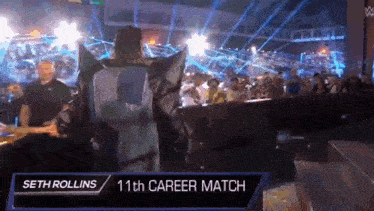 seth rollins is walking out of the ring during the 11th career match .