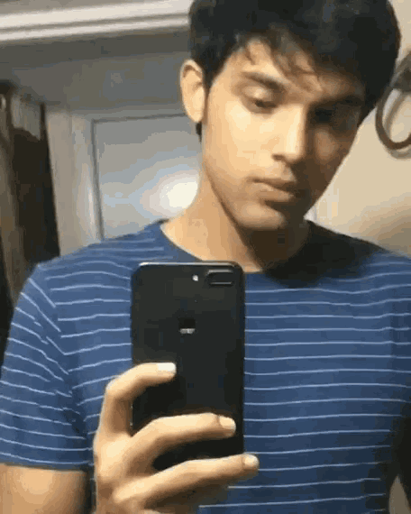 a man is taking a selfie with his iphone