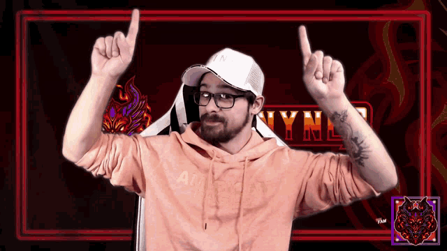 a man wearing a white hat and a pink hoodie with the word lynn on the bottom