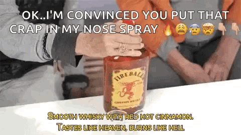 a bottle of fireball whiskey on a table