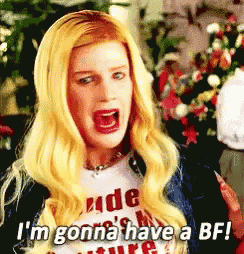 a woman with blonde hair is wearing a white shirt that says rude 's my future .
