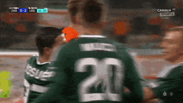 a soccer player with the number 20 on his shirt