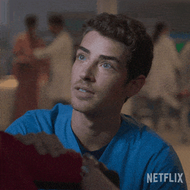 a close up of a man 's face with a netflix logo on the bottom right