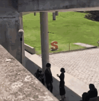 the letter s is painted on the grass in a field