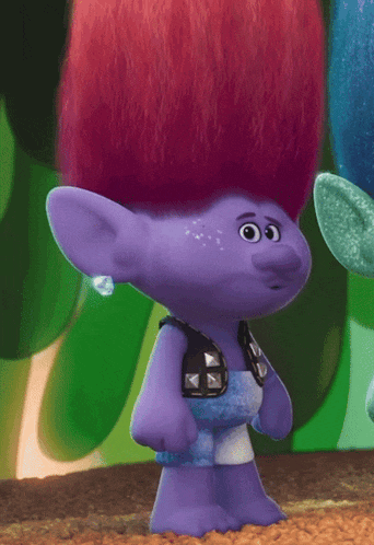 a troll with red hair is wearing a purple shirt with spikes on it