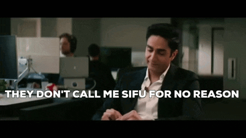 a man in a suit is sitting in front of a computer and says they don t call me sifu for no reason