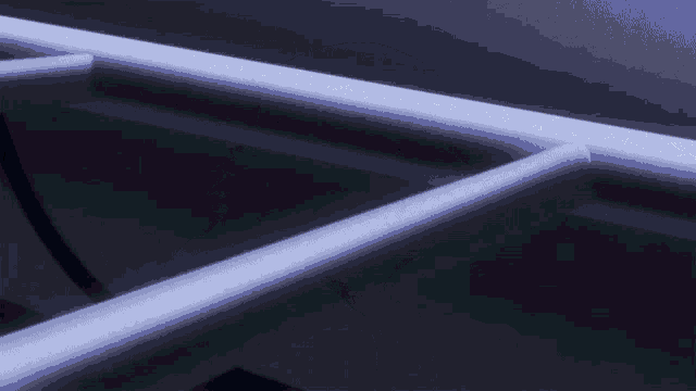 a person 's hand is reaching for a metal railing