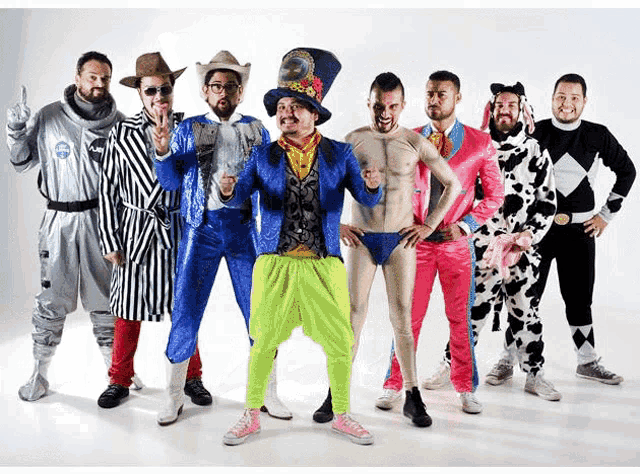 a group of men are posing for a picture and one of them is wearing a top hat with the letter e on it