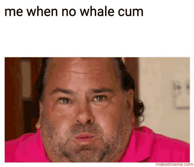a man with a beard wearing a pink shirt is making a funny face