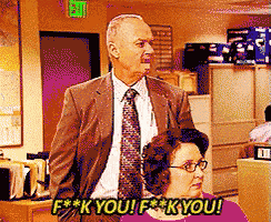 a man in a suit and tie is standing next to a woman with the words f * k you f * k you