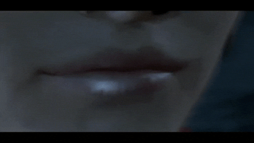 a close up of a person 's lips with a few white spots on them