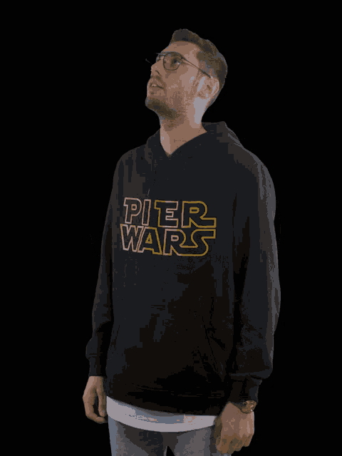 a man wearing a pier wars hoodie dancing