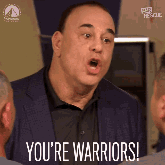 a man in a suit says " you 're warriors " in front of a paramount network logo
