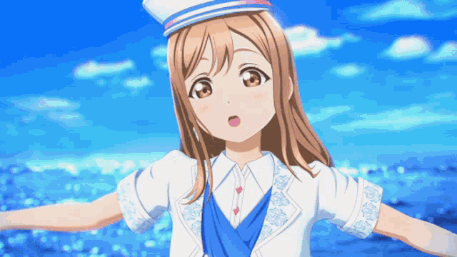 a girl in a sailor outfit stands in front of a blue ocean