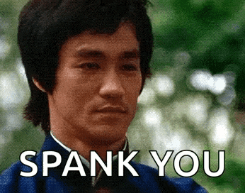 a man in a blue jacket is saying spank you