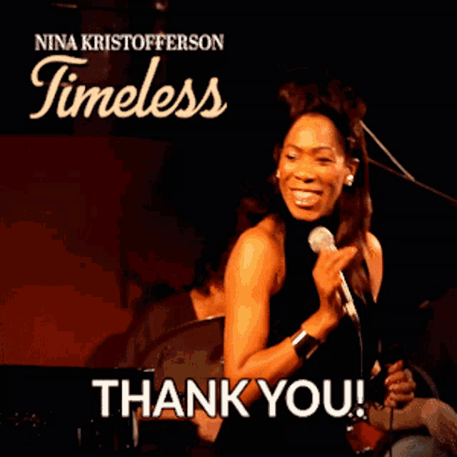 a woman singing into a microphone with the words thank you below her