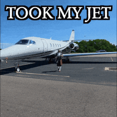 a woman is walking towards a plane with the words took my jet written above her