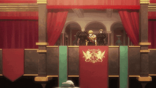a group of people standing on a balcony with a red banner with a lion and a bird on it
