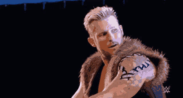 a pixelated image of a wrestler with the letters w on the bottom