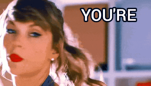 a close up of a woman 's face with the words " you 're " in the background