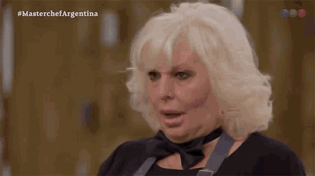 a woman with a surprised look on her face is featured on a television show called master chef argentina