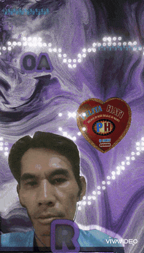a man 's face is behind a heart that says hati