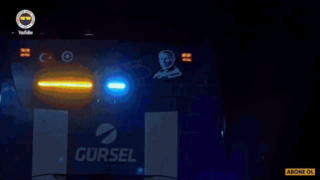 a blue light behind a sign that says gürsel