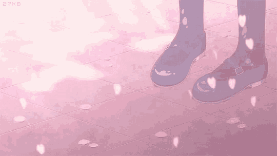 a girl in blue shoes is standing on a pink tile floor with petals falling around her