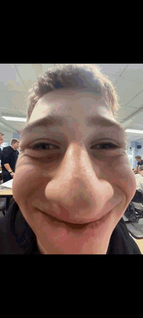 a close up of a man 's face with a huge nose