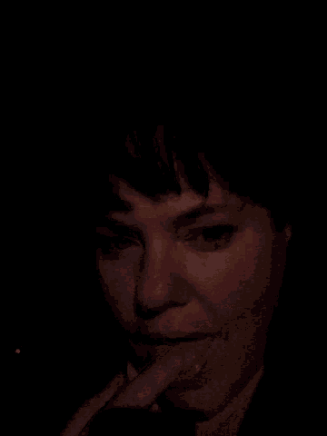 a close up of a person 's face with their mouth open