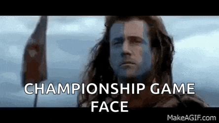 a man with a flag on his face and the words `` championship game face '' written above him .