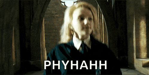 a woman in a harry potter movie is standing in a hallway with phyhanh written on the bottom