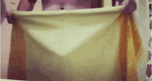 a person is wrapped in a yellow cloth