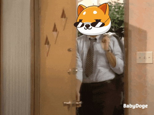a man in a suit and tie is standing in a doorway with a cartoon dog on his face and the words babydoge below him