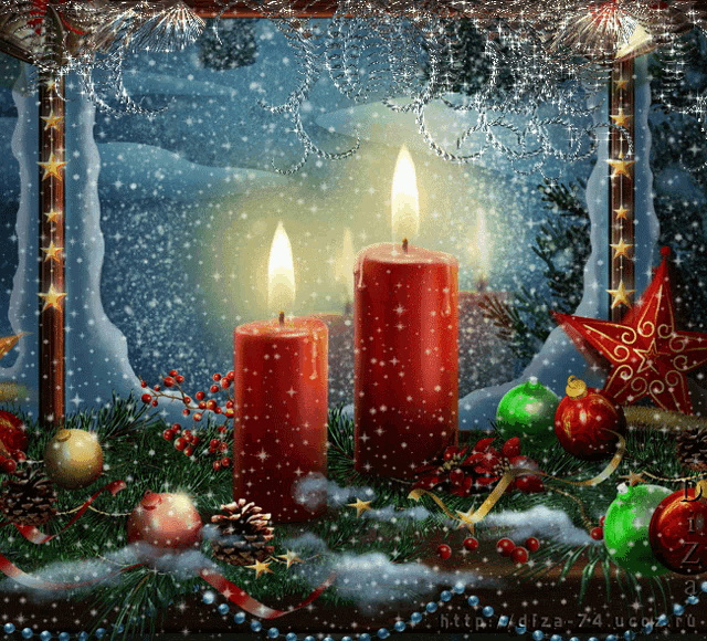 two red candles are lit in front of a christmas scene