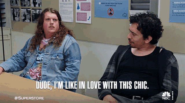 two men are sitting at a table and one of them is saying dude i 'm like in love with this chic
