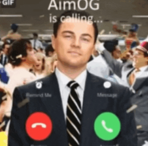 a man in a suit and tie is making a call