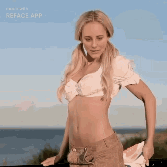 a woman in a white top and shorts is stretching her legs .