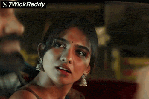 a close up of a woman 's face with the words x7wickreddy written above her