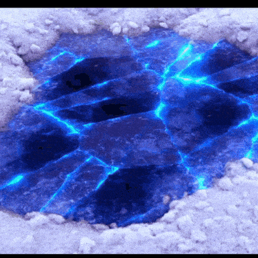 a hole in the ground filled with blue water