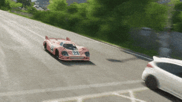 a pink race car has the number 23 on the front