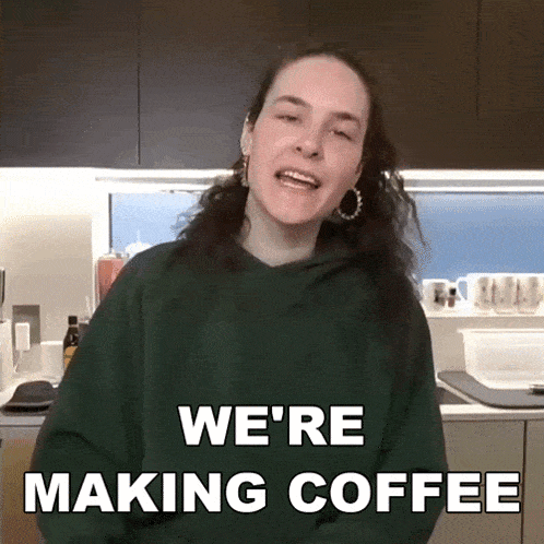 a woman wearing a green hoodie says we 're making coffee