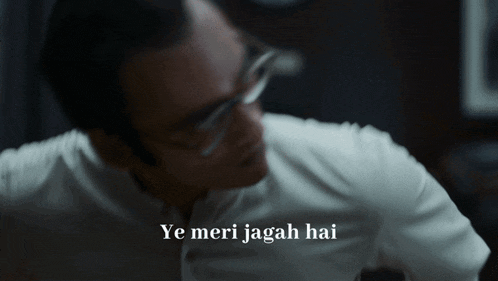 a man with glasses and the words ye meri jagah hai behind him