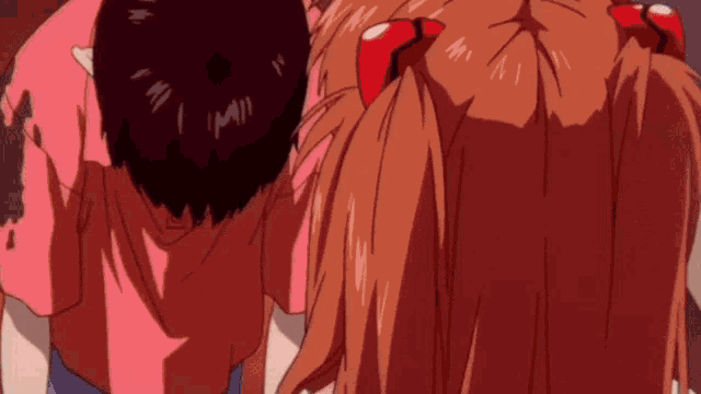 a man and a girl are standing next to each other and the girl is wearing a red bow in her hair