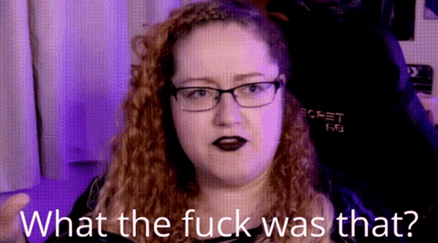 a woman wearing glasses says what the fuck was that