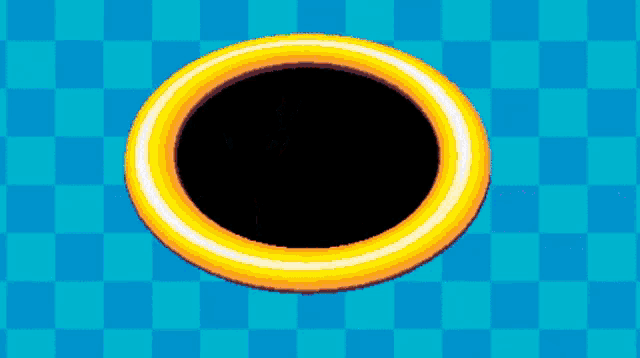 a yellow ring with a black hole in the middle on a blue checkered background .